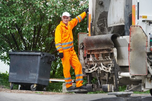 Team members removing household waste